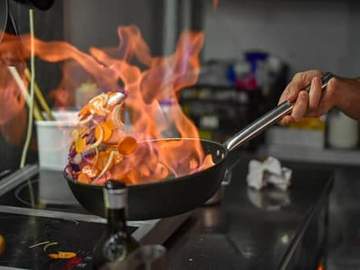 vegetables flambeed in pan